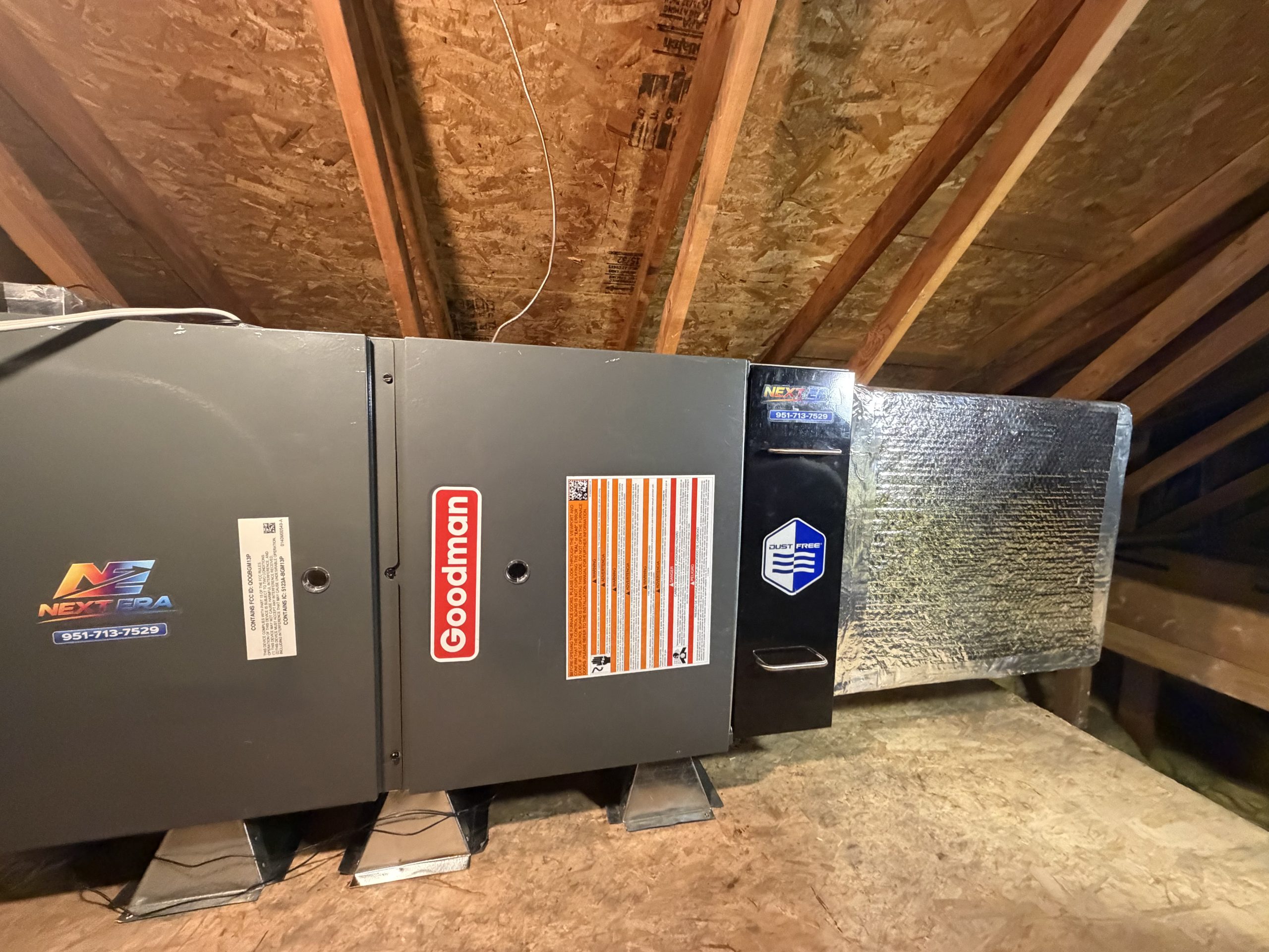 Goodman furnace and air handler installed by Next Era, branded sticker visible